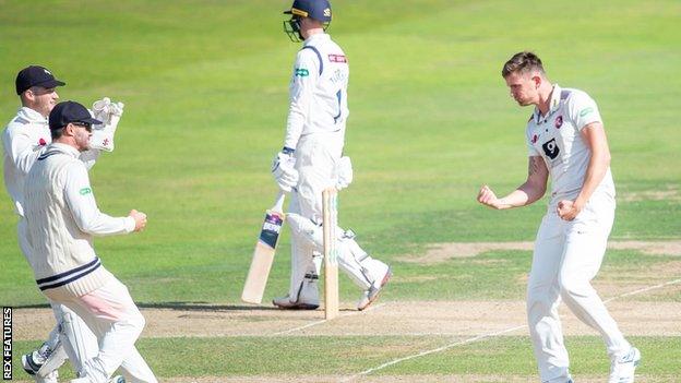 Matthew Milnes celebrates a wicket for Kent