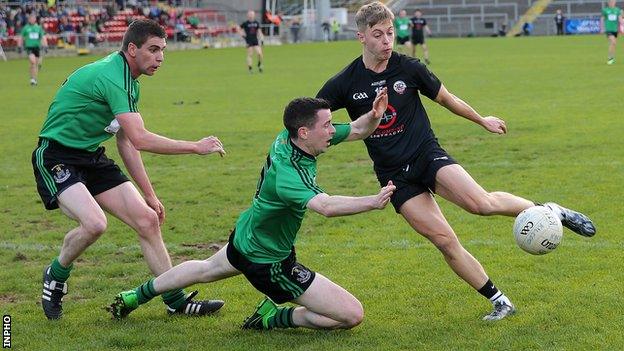 Castlewellan pair Daniel Morgan and Barry Travers close in on Kilcoo's Jerome Johnston