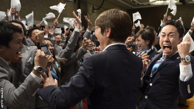 Tokyo 2020 delegation members celebrate after IOC president Jacques Rogge announced the Japanese capital to be the winner of the bid to host the 2020 Summer Olympic Games