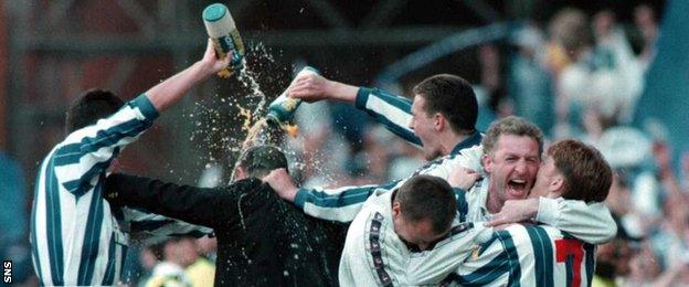 Kilmarnock players soak Bobby Williamson in celebration after their 1997 Scottish Cup win