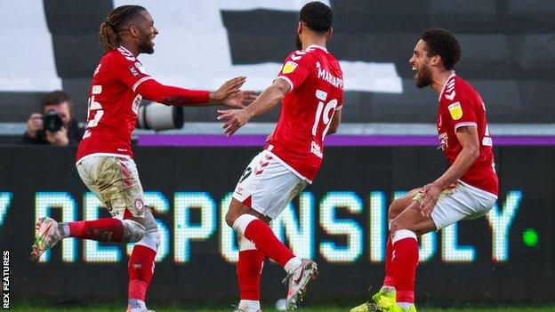 Kasey Palmer (left) celebrates after scoring his first goal since returning to Bristol City from his loan spell at Swansea