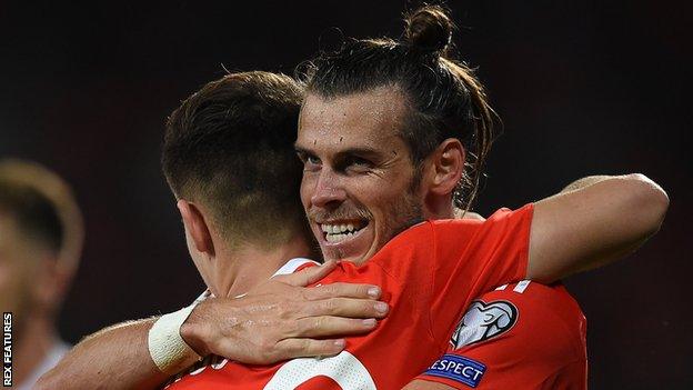 Gareth Bale celebrates with Ben Woodburn