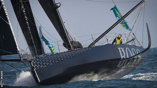 Alex Thomson on board Hugo Boss at the start of the Route Du Rhum