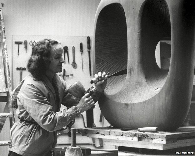 Barbara Hepworth in St Ives at work on the wood carving Hollow Form with White Interior (1963)