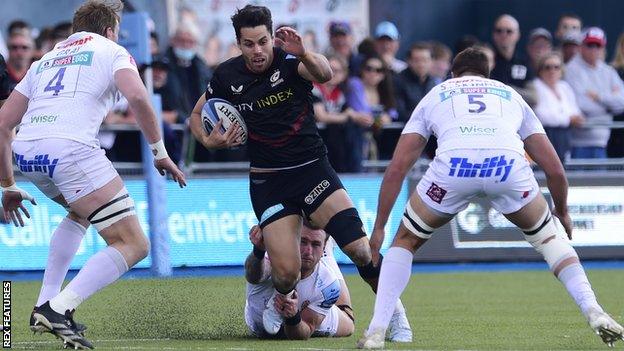 Sean Maitland of Saracens is tackled by Stuart Hogg of Exeter Chiefs