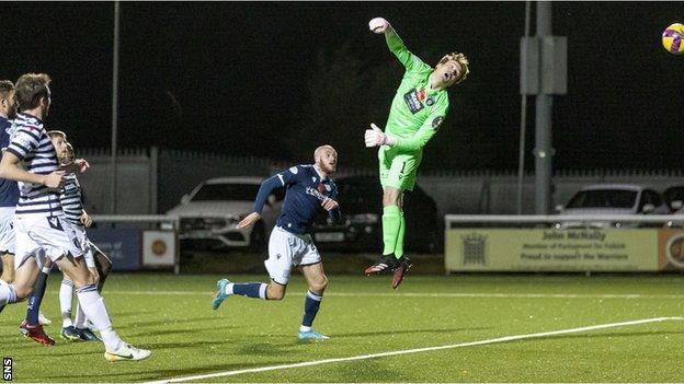 A free-kick from Paul McMullan loops into the net for Dundee's first equaliser