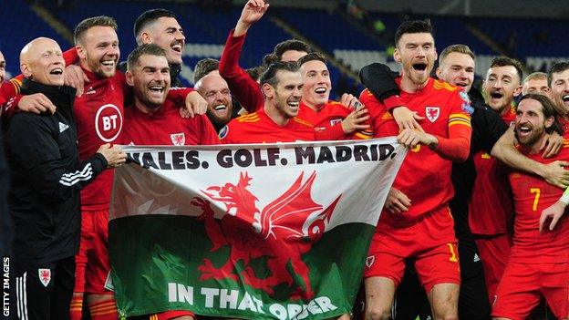 Tom KIng, third from the left, alongside Gareth Bale celebrating victory over Hungary that sealed Euro qualification