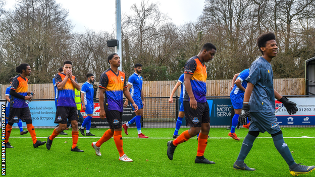 Chagos Islands national team walk out for a match