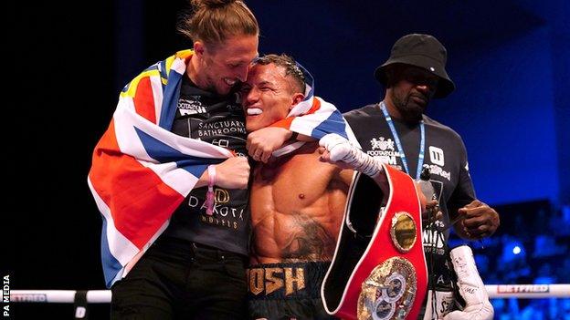 Luke Ayling hugs Josh Warrington