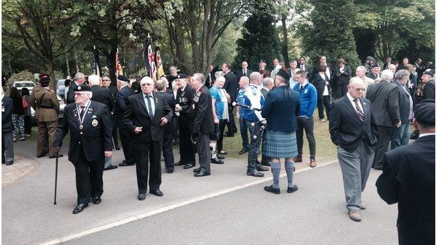 Dozens at funeral