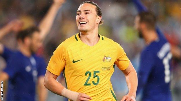 Jackson Irvine celebrates with Australia against Greece