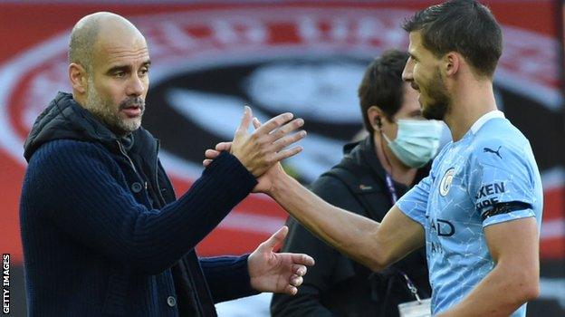 Manchester City boss Pep Guardiola and defender Ruben Dias