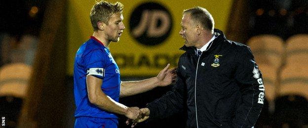 Richie Foran and John Hughes shake hands