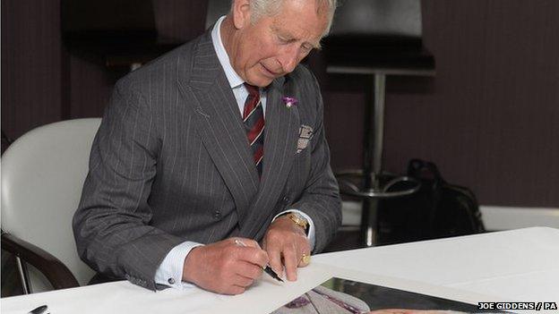 Prince Charles signing photo