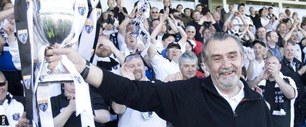 Brooks Mileson with the Scottish First Division trophy