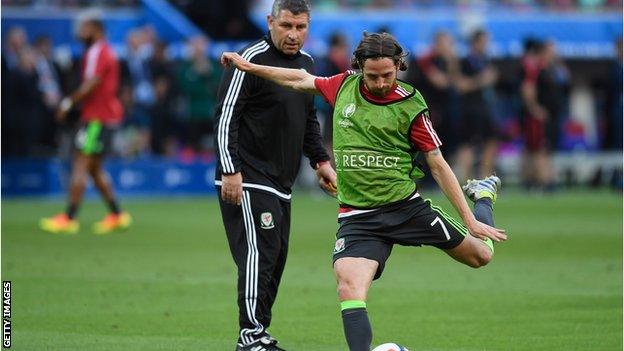 Wales assistant Osian Roberts (behind Joe Allen) is one of the candidates to succeed Chris Coleman as Wales manager