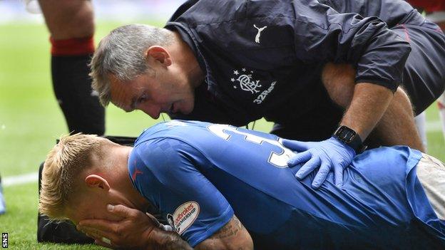 Martyn Waghorn holds his head in his hands after suffering a hamstring injury against Hamilton