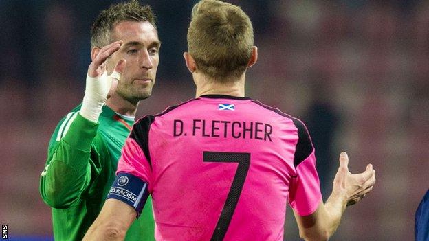 Scotland captain Darren Fletcher salutes goalkeeper Allan McGregor