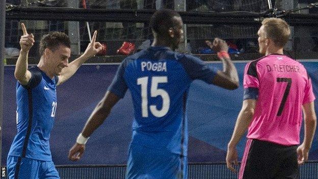 Laurent Koscielny (left) celebrates for France against Scotland