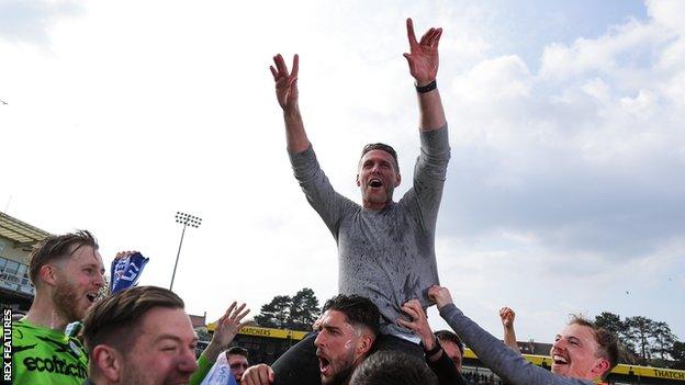 Forest Green manager Rob Edwards celebrates the team's promotion