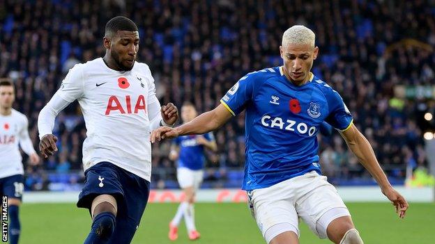 Emerson Royal and Richarlison challenge for the ball