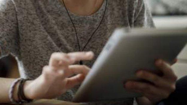 School pupil with mobile device