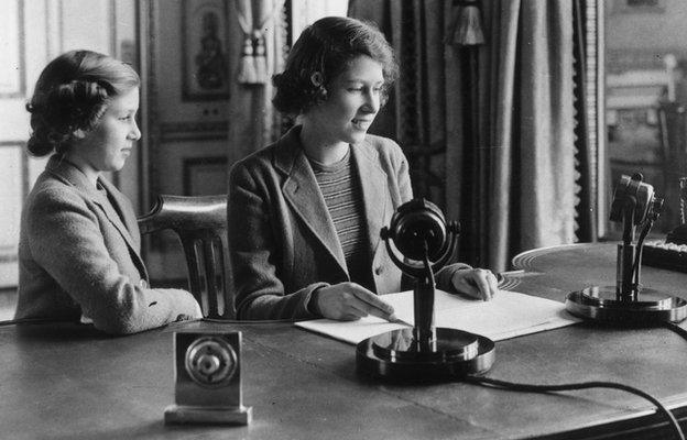 Princess Elizabeth makes her first broadcast, accompanied by her younger sister Princess Margaret Rose on 12 October 1940 in London