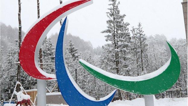 Paralympic logo is partly covered with snow