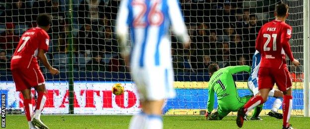 Nahki Wells of Huddersfield Town steals the ball off Frank Fielding of Bristol City to score his sides second goal