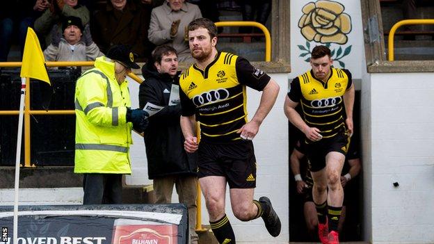 Melrose captain Grant Runciman leads out his team