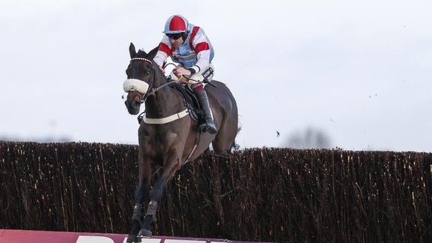 Aidan Coleman riding Saint Calvados clear the last to win The Betfred Mobile Novices' Limited Handicap Chase at Newbury