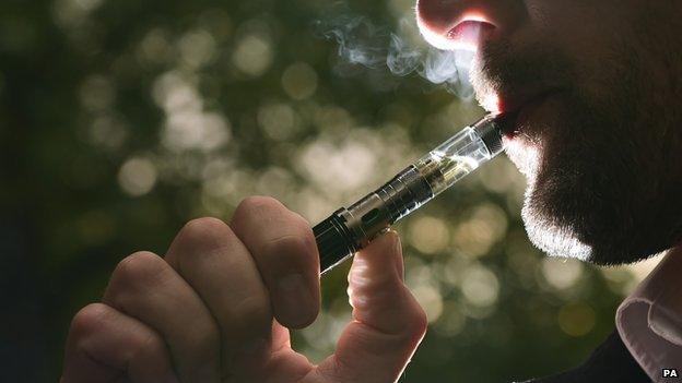 A man smoking an electronic cigarette