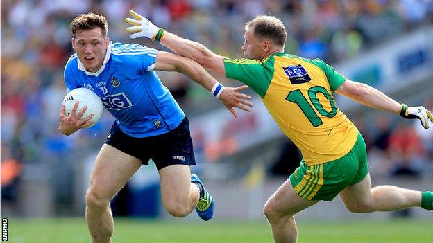 Paul Flynn is challenged by Anthony Thompson during the first half