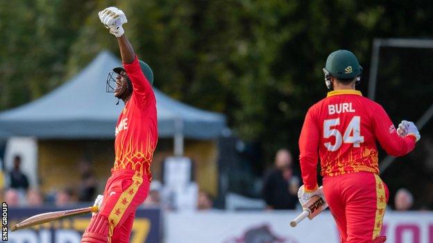 Milton Shumba celebrates Zimbabwe's win during a T20 international between Scotland and Zimbabwe at the Grange