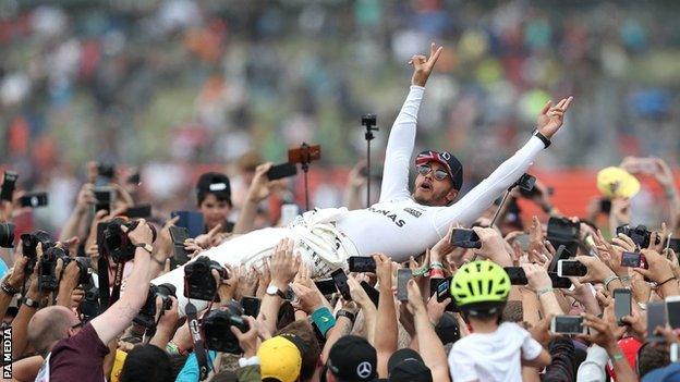 Lewis Hamilton celebrates winning the British Grand Prix