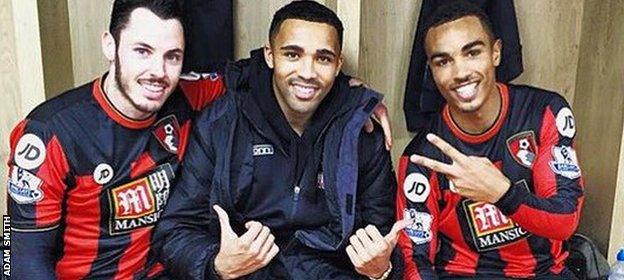 Adam Smith celebrates beating Manchester United with Bournemouth team-mates Callum Smith and Junior Stanislas