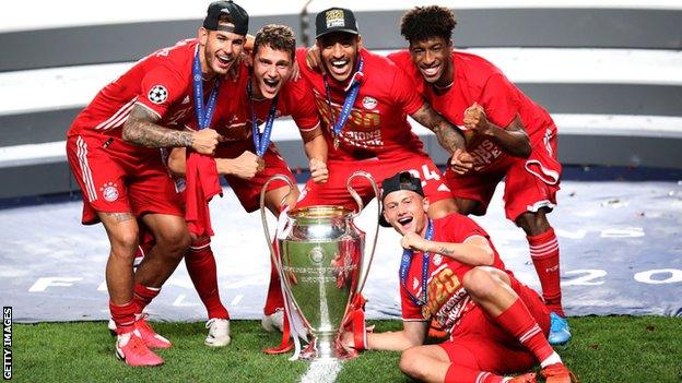 Bayern Munich players celebrate with the Champions League trophy