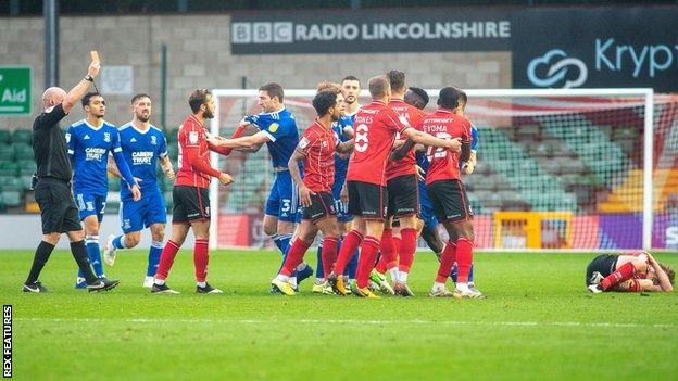 Jon Nolan's 94th-minute red card for Ipswich led to heated scenes in the dying moments of Lincoln's win last month