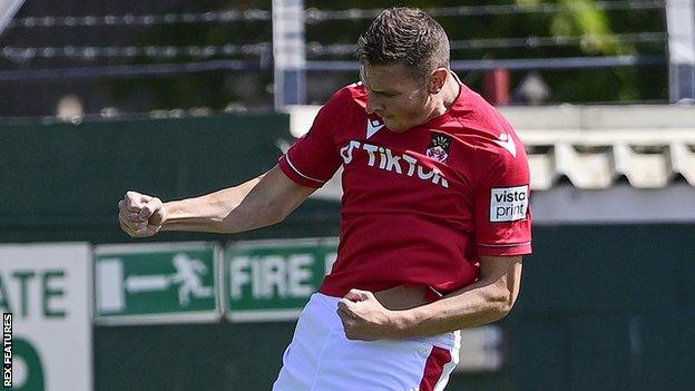 Paul Mullin celebrates after scoring his first goal of the season