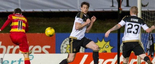 Partick Thistle's Steven Lawless sends his drive into the Aberdeen net