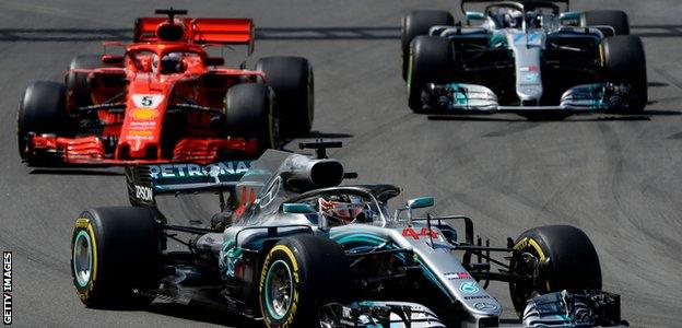 Mercedes' Lewis Hamilton leads teammate Valtteri Bottas (right) and Ferrari's Sebastian Vettel