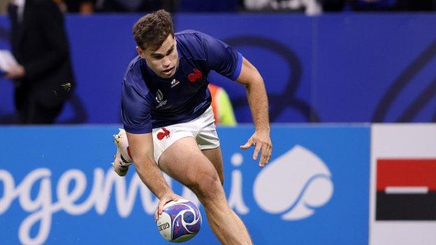 Damian Penaud of France scores a try