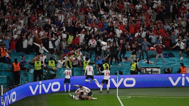 England players celebrating in front of fans at Wembley