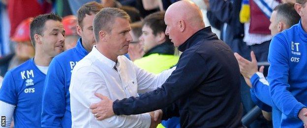 Kilmarnock manager Lee Clark is congratulated by Peter Houston