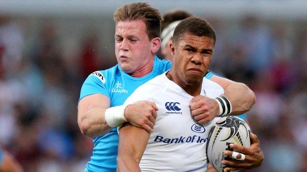 Ulster's Craig Gilroy tackles Leinster's Adam Byrne at Kingspan Stadium