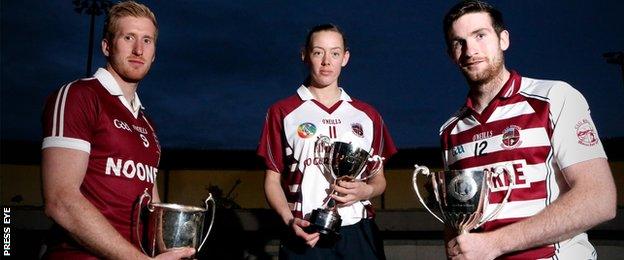 Paudie McGuigan, Louise Dougan and Gerald Bradley with this year's Derry championship trophies