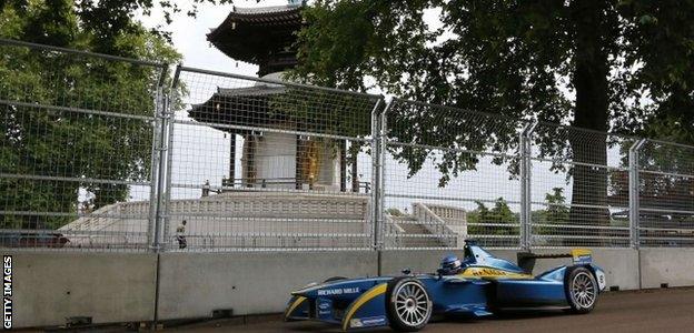 French driver Nicolas Prost drives past the peace pagoda at Battersea Park