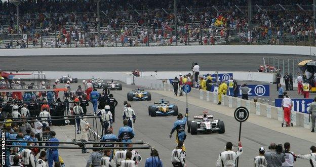 Cars enter the pits before the 2005 United States Grand Prix start