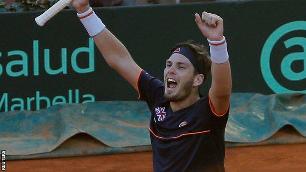 Cameron Norrie celebrates beating Roberto Bautista Agut