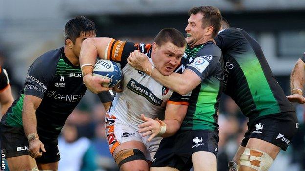 Tigers' Jarrad Butler is tackled by Connacht fly-half Jack Carty